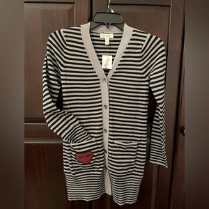 Girls long striped sweater with cute heart accent on front pocket. Brand new.